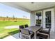 Relaxing covered patio with outdoor dining furniture at 2513 Shorebird Dr, Fuquay Varina, NC 27526