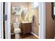 Small bathroom with single vanity, toilet and updated flooring at 2517 Shepherd Valley St, Raleigh, NC 27610