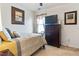 Bright bedroom with a double bed and dresser at 2517 Shepherd Valley St, Raleigh, NC 27610