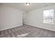 Well-lit bedroom with carpet flooring and exterior view at 319 Travelers Ct, Mebane, NC 27302