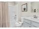 Clean bathroom with a bathtub, toilet and vanity with a modern faucet at 35 Catbird Ln, Franklinton, NC 27525