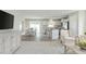 Open concept living and kitchen with island, table and chairs, and media console at 35 Catbird Ln, Franklinton, NC 27525