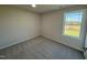 Spacious bedroom with carpet and a window offering views at 36 Holly Grove Ln, Lillington, NC 27546