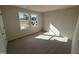 Well-lit bedroom featuring carpet and dual windows at 36 Holly Grove Ln, Lillington, NC 27546