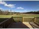 Deck overlooking a spacious grassy yard and trees at 36 Holly Grove Ln, Lillington, NC 27546