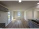 Kitchen dining area with LVP flooring and access to back deck at 36 Holly Grove Ln, Lillington, NC 27546