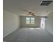 Living room with neutral carpeting and view of the front yard at 36 Holly Grove Ln, Lillington, NC 27546