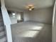 Spacious living room with neutral carpeting and lots of natural light at 36 Holly Grove Ln, Lillington, NC 27546