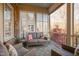 Cozy screened porch with seating area and view of backyard at 4129 Gardenlake Dr, Raleigh, NC 27612