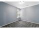 Bright bedroom with gray carpet and one window at 430 Carrington Dr, Garner, NC 27529