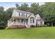 Two-story house with a front porch, landscaping, and a large yard at 430 Carrington Dr, Garner, NC 27529