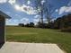 Open backyard with a view of neighboring homes and trees at 45 New Bethel Ct, Lillington, NC 27546