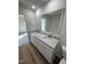 Double vanity bathroom with granite countertop and view of bedroom at 45 New Bethel Ct, Lillington, NC 27546