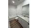 Bathroom with white vanity, granite countertop, and a bathtub at 45 New Bethel Ct, Lillington, NC 27546