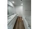 Bathroom with double vanity, granite countertop, and soaking tub at 45 New Bethel Ct, Lillington, NC 27546