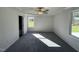 Spacious primary bedroom with ceiling fan and large windows at 45 New Bethel Ct, Lillington, NC 27546
