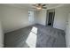 Well-lit bedroom with grey carpet and access to a hallway at 45 New Bethel Ct, Lillington, NC 27546