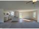 Open concept kitchen with island, white cabinets, and granite countertops at 45 New Bethel Ct, Lillington, NC 27546