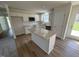 Open concept kitchen with island, white cabinets and granite countertops at 45 New Bethel Ct, Lillington, NC 27546