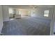 Open concept living room and kitchen with hardwood and carpet flooring at 45 New Bethel Ct, Lillington, NC 27546