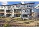 Townhouse rear view showcasing private decks and wooded area at 4806 Cypress Tree Ln, Raleigh, NC 27612