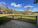 Wooden deck overlooking a tree filled backyard at 50 Holly Grove Ln, Lillington, NC 27546