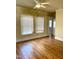 Bright bedroom with hardwood floors and ceiling fan at 504 Summitt Dr, Sanford, NC 27330