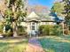 Charming house with brick walkway, mature trees, and well-maintained landscaping at 504 Summitt Dr, Sanford, NC 27330