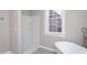 Modern bathroom featuring a walk-in shower and a free-standing bathtub at 704 Pender St, Rocky Mount, NC 27801