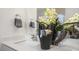 Modern bathroom with double vanity, large mirror, and decorative plants at 86 Ethel Ln, Angier, NC 27501