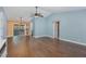 Open living space with hardwood floors and access to dining area at 9100 Greenbriar Sta, Chapel Hill, NC 27516