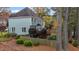 Two-story house with gray siding, deck, and landscaped yard at 100 Cutty Ct, Cary, NC 27518