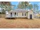 Backyard view of house, deck, and storage shed at 1024 Deep Canyon Dr, Clayton, NC 27520