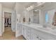 Bathroom features double vanity, white cabinets and a large mirror at 105 Valleycruise Cir, Garner, NC 27529