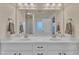 Double vanity bathroom with a large mirror and shower at 105 Valleycruise Cir, Garner, NC 27529