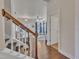 Bright entryway with hardwood floors, staircase, and views into the living room at 105 Valleycruise Cir, Garner, NC 27529