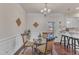 Modern kitchen with white cabinets, granite counters, and breakfast bar at 105 Valleycruise Cir, Garner, NC 27529