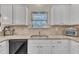 Kitchen features granite countertops, white cabinets, and a double sink at 105 Valleycruise Cir, Garner, NC 27529