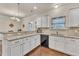 Kitchen features granite countertops, white cabinets, and a breakfast bar at 105 Valleycruise Cir, Garner, NC 27529