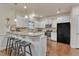 Modern kitchen with white cabinets, granite counters, and breakfast bar at 105 Valleycruise Cir, Garner, NC 27529