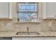 Kitchen features granite countertops, white cabinets, and a double sink at 105 Valleycruise Cir, Garner, NC 27529