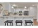 Modern kitchen with white cabinets, granite counters, and breakfast bar at 105 Valleycruise Cir, Garner, NC 27529
