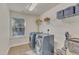Laundry room with washer, dryer, and shelving at 105 Valleycruise Cir, Garner, NC 27529