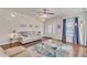 Open living room with hardwood floors, a fireplace, and neutral-toned furniture at 105 Valleycruise Cir, Garner, NC 27529