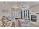 Spacious living room with hardwood floors, a fireplace, and neutral-toned furniture at 105 Valleycruise Cir, Garner, NC 27529