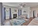 Bright living room with hardwood floors, a fireplace, and neutral-toned furniture at 105 Valleycruise Cir, Garner, NC 27529