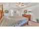 Spacious main bedroom with wood furniture and ceiling fan at 105 Valleycruise Cir, Garner, NC 27529
