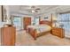 Spacious main bedroom with wood furniture and ceiling fan at 105 Valleycruise Cir, Garner, NC 27529