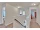 Upstairs hallway with access to bedrooms and staircase at 105 Valleycruise Cir, Garner, NC 27529