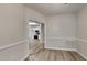 View of kitchen from dining room with hardwood floors at 1112 Minnie Dr, Raleigh, NC 27603